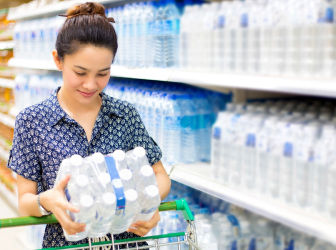 Bottled Water-Woman Buys Bottled Water in the Supermarket_0 1